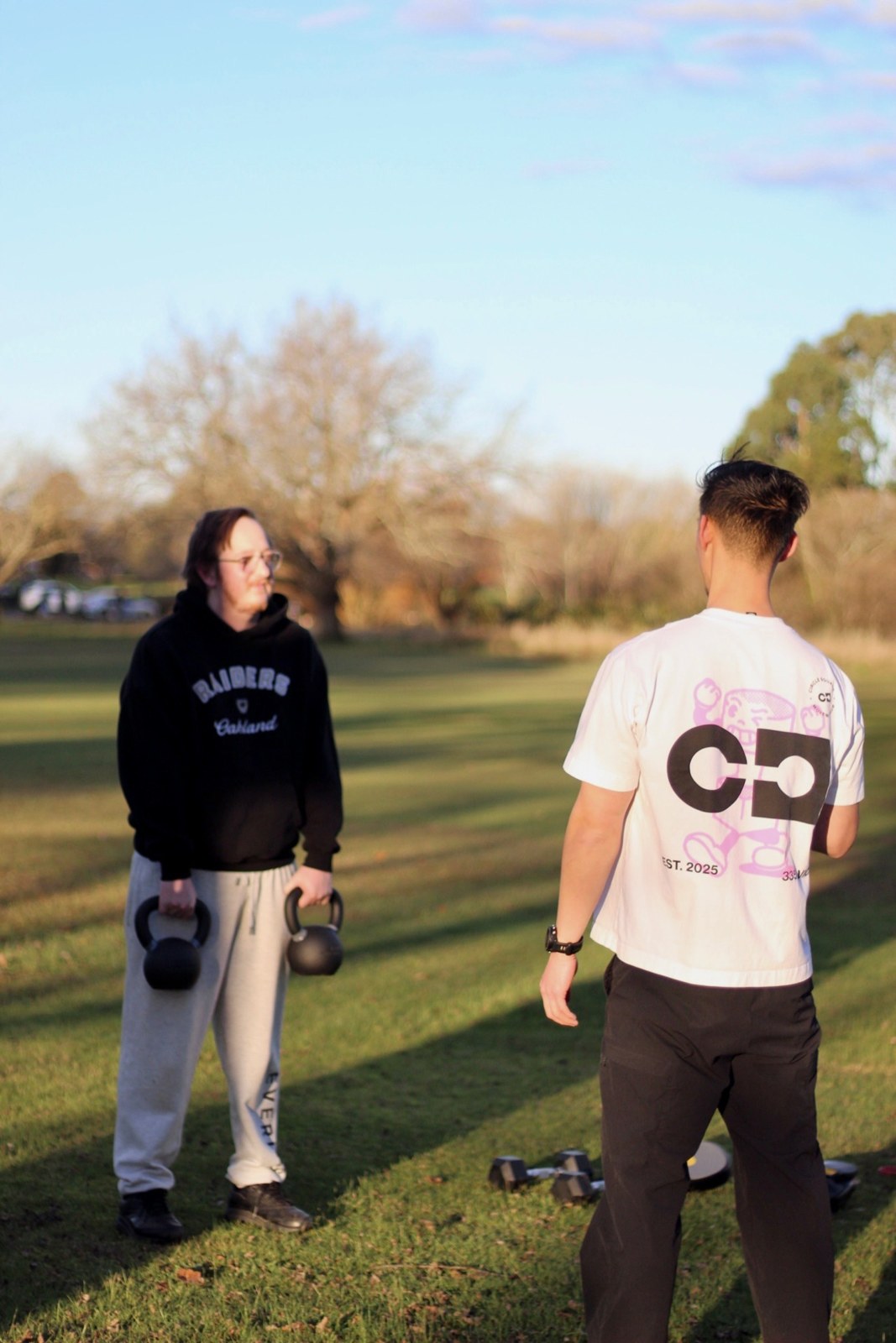 A golden-hour kettlebell session on the grass
