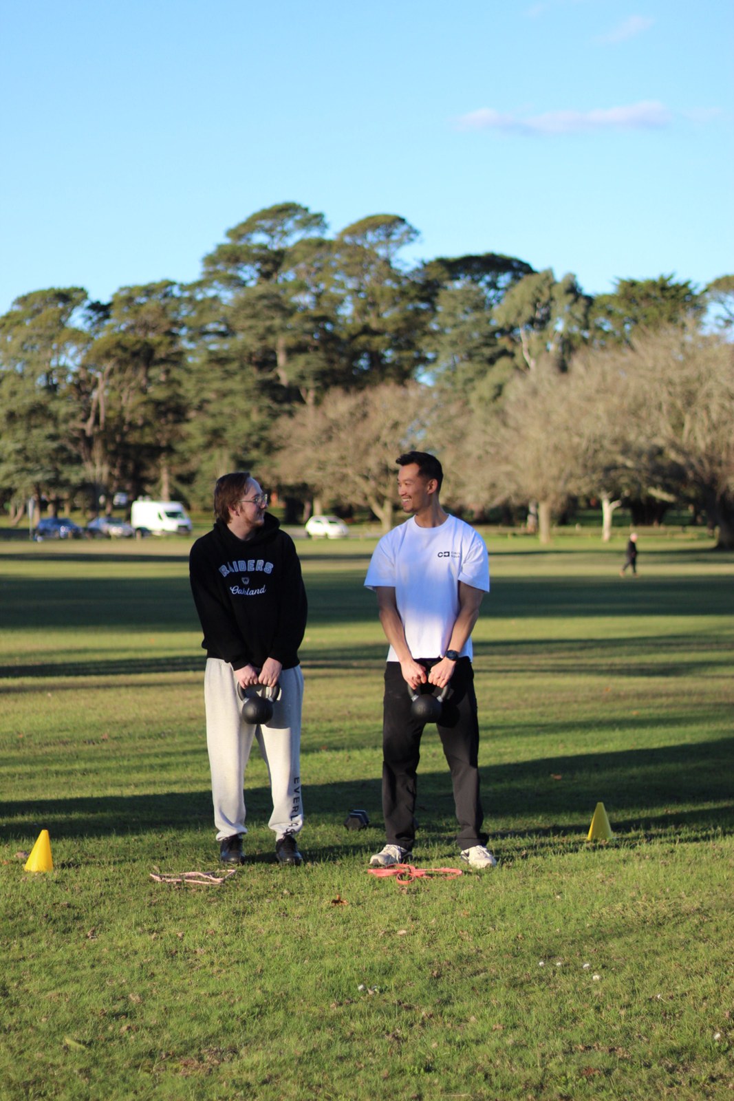 A side-by-side session with kettlebells