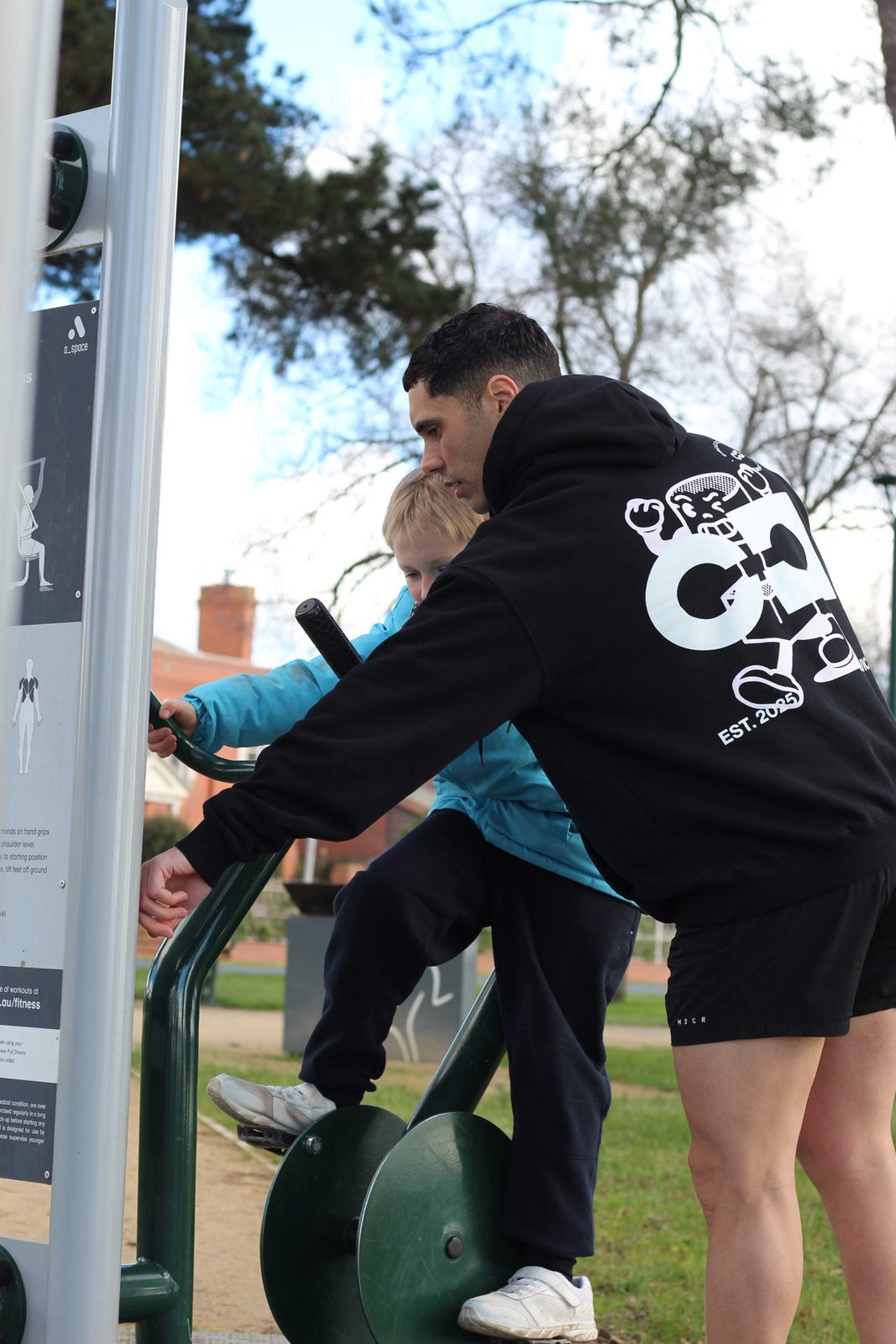 Supporting a participant through a strength movement outdoors